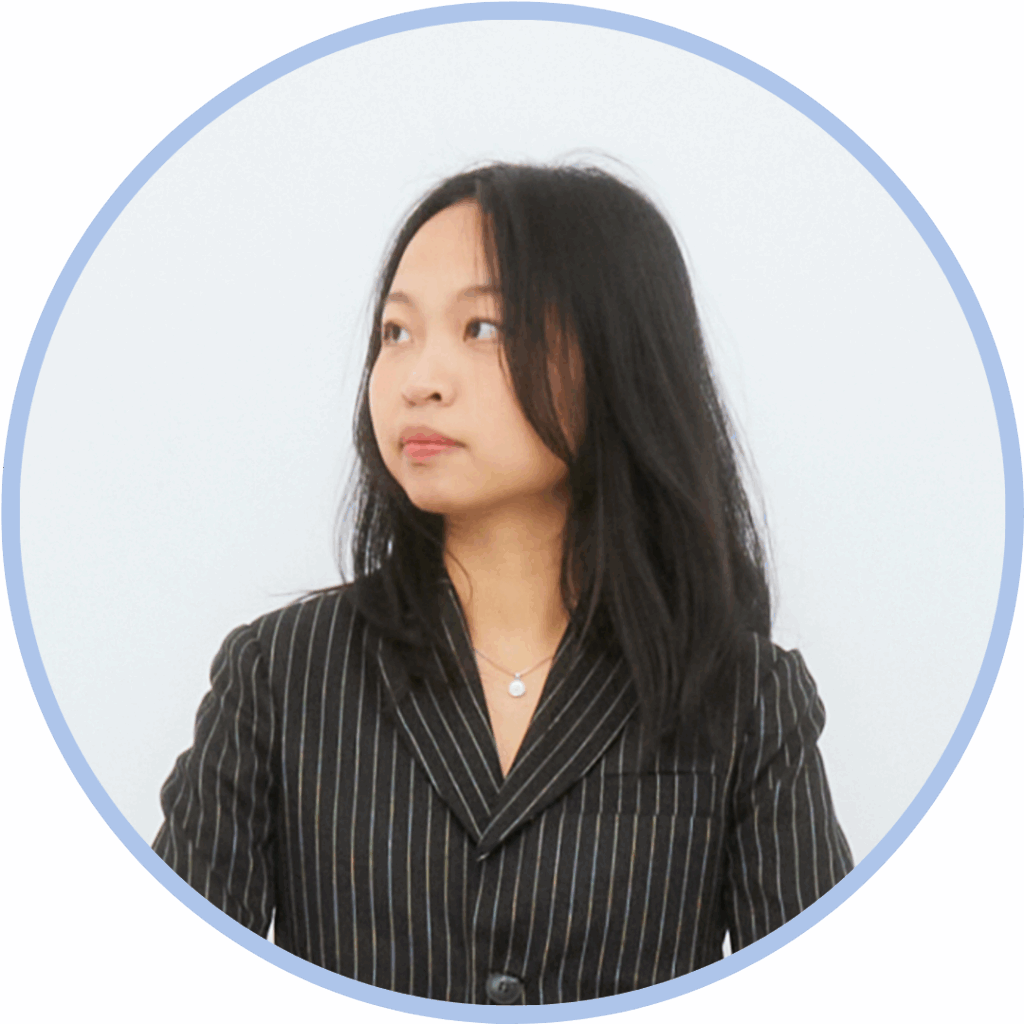 Asian woman with dark brown hair looking away from the camera to the left