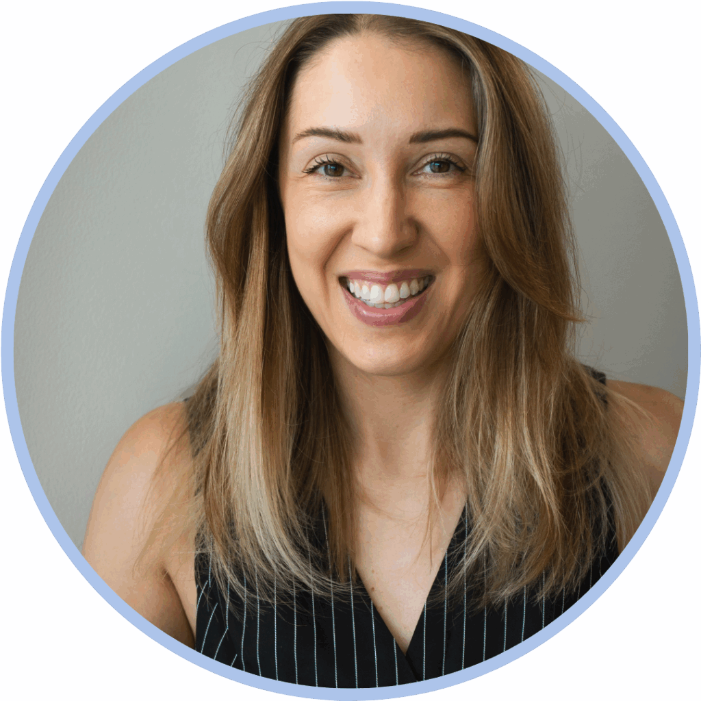 Headshot of white woman with blonde hair smiling to camera