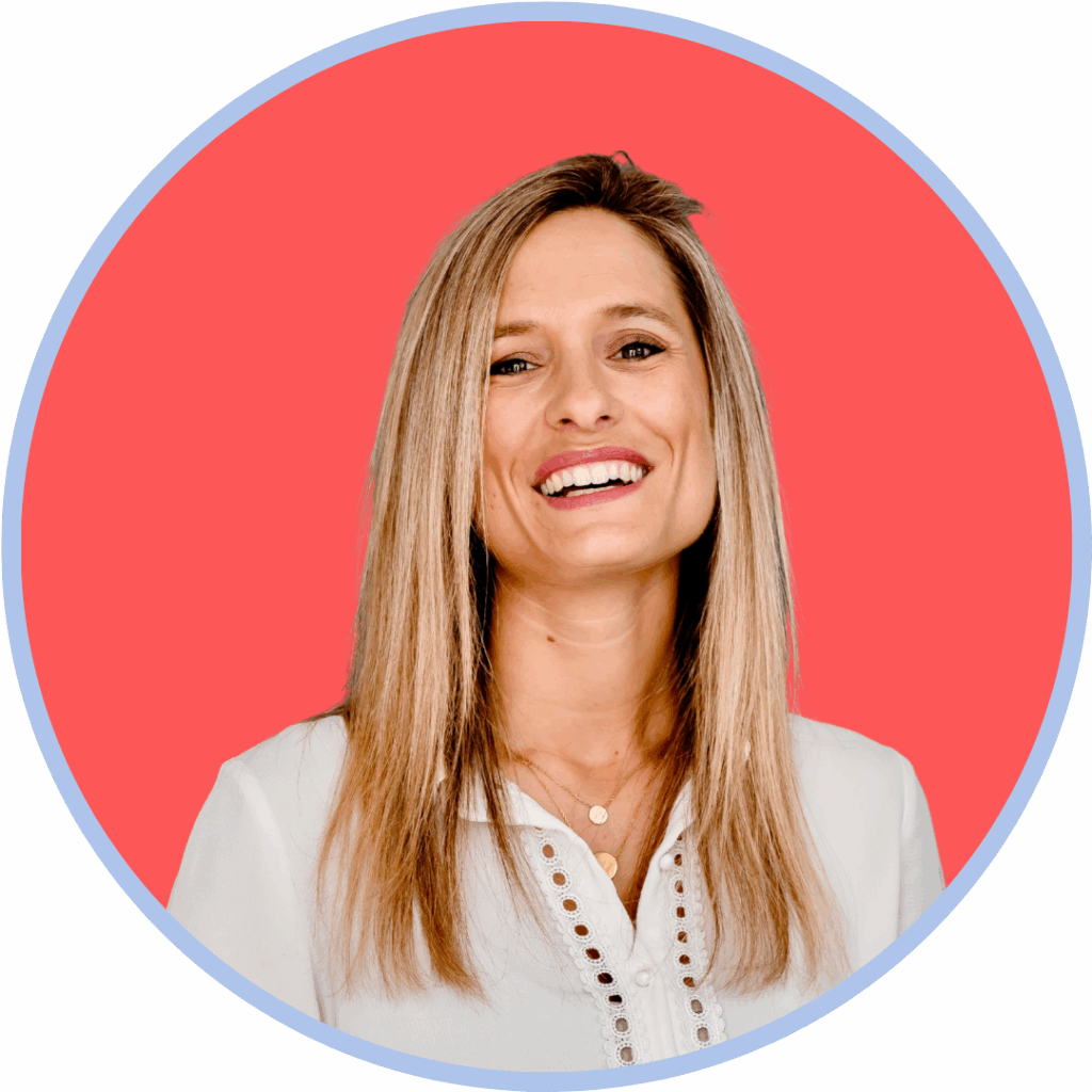 Headshot of a white woman with shoulder length blonde hair in front of a pink background
