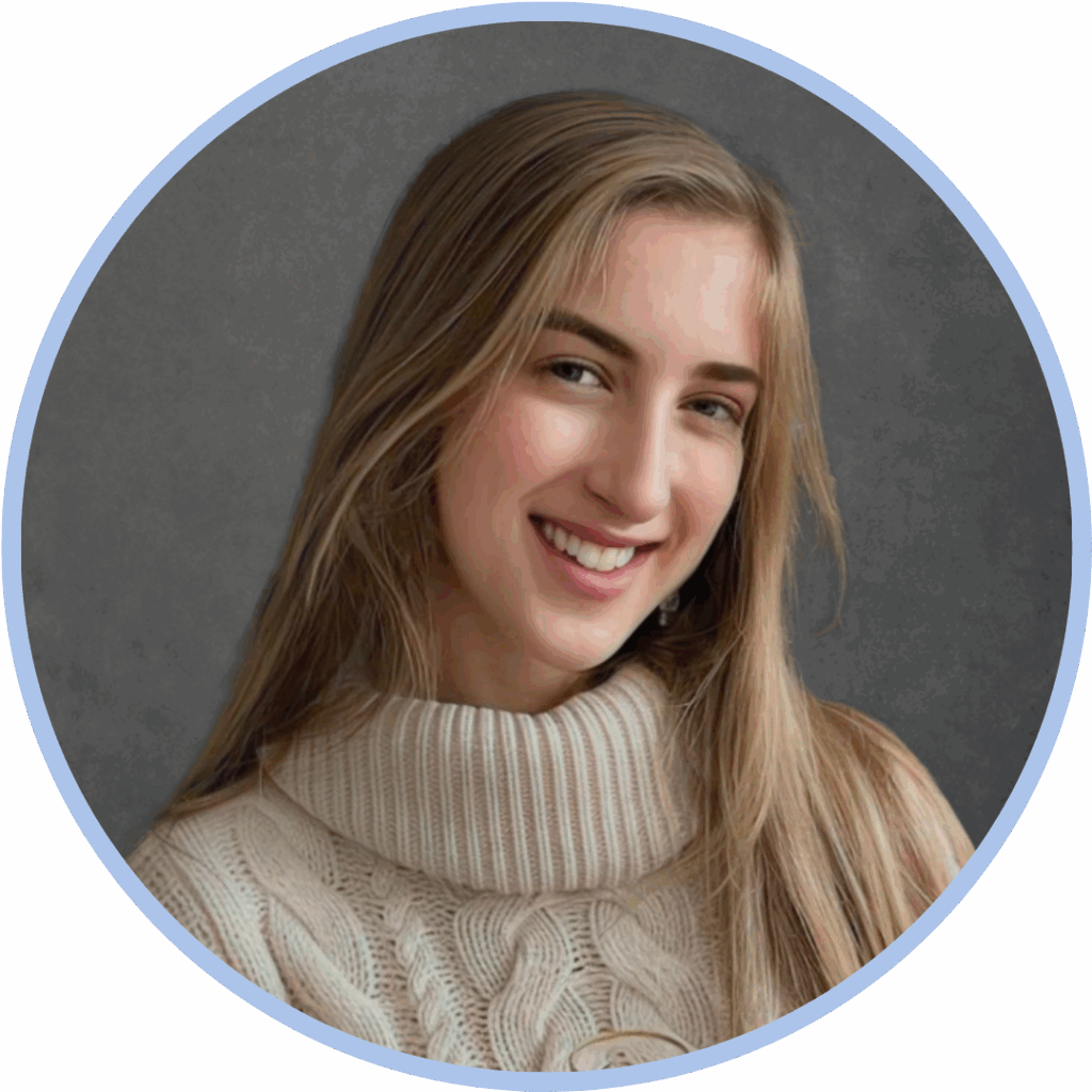 Headshot of a white woman with long blonde hair wearing a cream roll neck jumper and smiling to camera